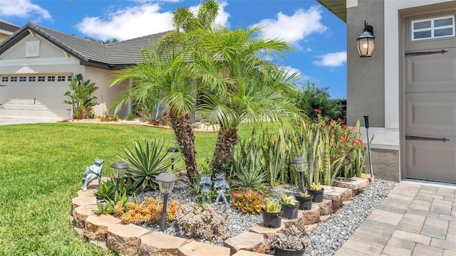 view of yard featuring a garage