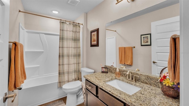 full bathroom with visible vents, shower / bath combo with shower curtain, toilet, and vanity