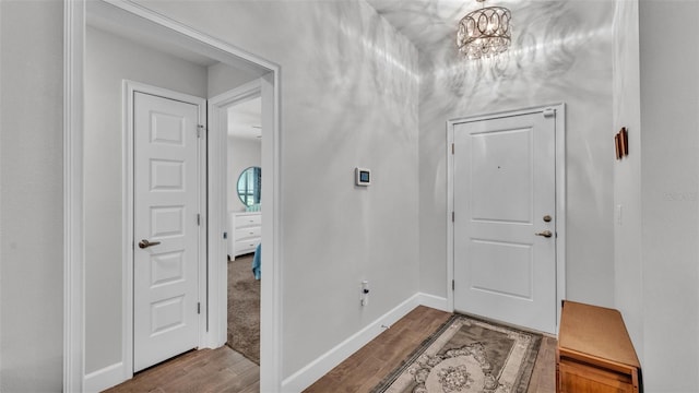interior space with baseboards and wood finished floors