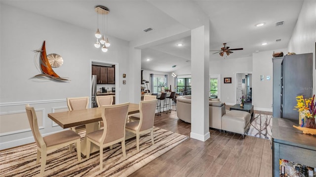dining room with wood finished floors, visible vents, ceiling fan, and recessed lighting