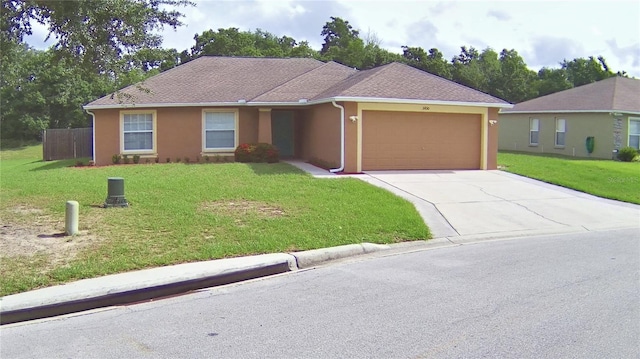 3430 Hilson Dr, Lakeland, FL 33812 - ranch-style home with stucco siding, driveway, a front yard, and a garage