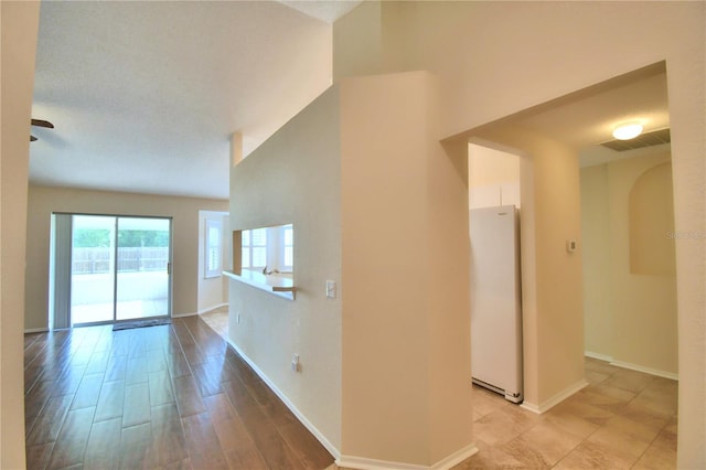 3430 Hilson Dr, Lakeland, FL 33812 - spare room with baseboards, visible vents, arched walkways, and light wood-style floors
