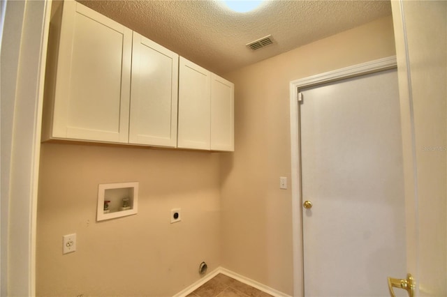 3430 Hilson Dr, Lakeland, FL 33812 - laundry area featuring visible vents, hookup for an electric dryer, hookup for a washing machine, cabinet space, and a textured ceiling