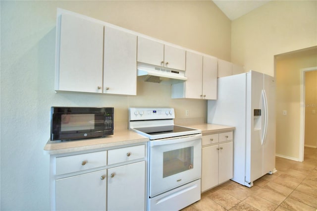 3430 Hilson Dr, Lakeland, FL 33812 - kitchen with under cabinet range hood, light tile patterned flooring, white appliances, and light countertops
