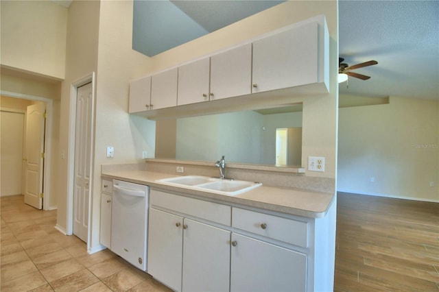 3430 Hilson Dr, Lakeland, FL 33812 - kitchen with white cabinets, light countertops, dishwasher, a sink, and ceiling fan