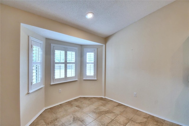 3430 Hilson Dr, Lakeland, FL 33812 - unfurnished room featuring baseboards and a textured ceiling