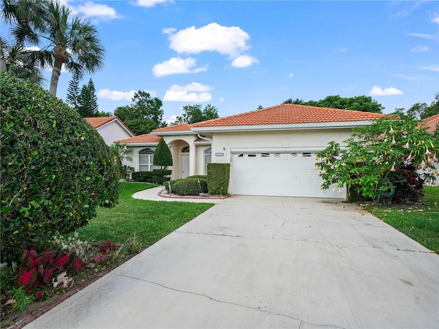 530 Greenway Dr, Lake Wales, FL 33898 - mediterranean / spanish house featuring a tiled roof, a front yard, concrete driveway, an attached garage, and stucco siding
