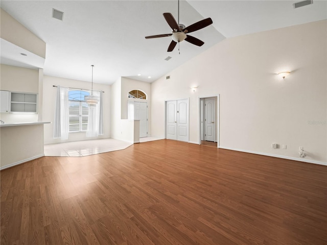 530 Greenway Dr, Lake Wales, FL 33898 - unfurnished living room with baseboards, ceiling fan, visible vents, and wood finished floors