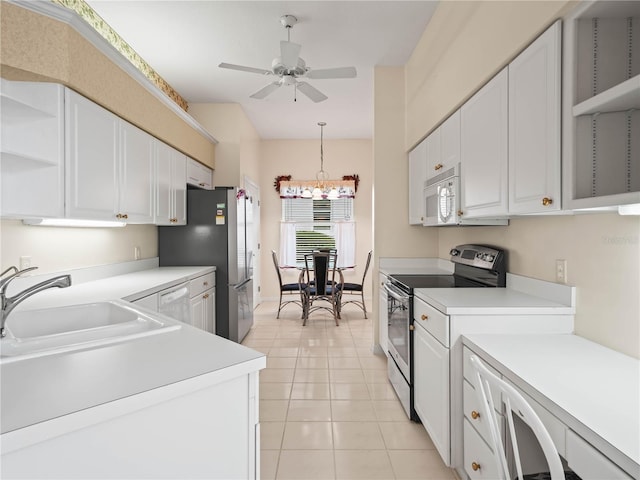 530 Greenway Dr, Lake Wales, FL 33898 - kitchen with open shelves, a sink, light countertops, stainless steel appliances, and white cabinetry