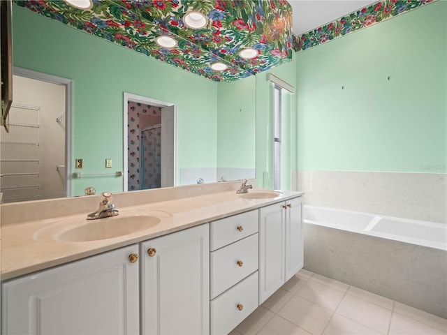 530 Greenway Dr, Lake Wales, FL 33898 - bathroom with double vanity, a shower stall, a sink, and a garden tub
