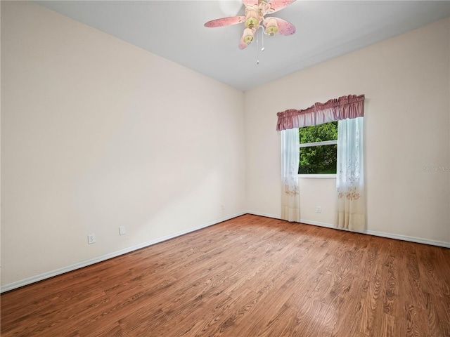 530 Greenway Dr, Lake Wales, FL 33898 - empty room featuring baseboards, ceiling fan, and wood finished floors