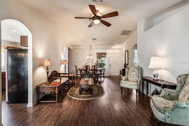 284 Lake Suzanne Dr, Lake Wales, FL 33859 - living room featuring arched walkways, wood finished floors, visible vents, and ceiling fan with notable chandelier