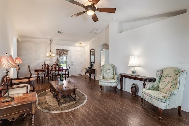 284 Lake Suzanne Dr, Lake Wales, FL 33859 - living area featuring vaulted ceiling, arched walkways, wood finished floors, and ceiling fan with notable chandelier