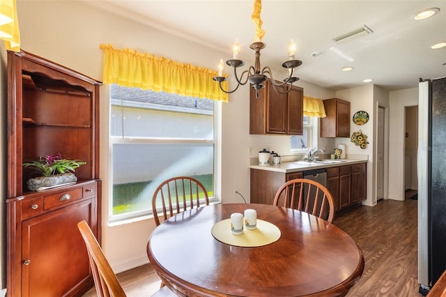 284 Lake Suzanne Dr, Lake Wales, FL 33859 - dining area featuring a healthy amount of sunlight, dark wood-style flooring, and visible vents