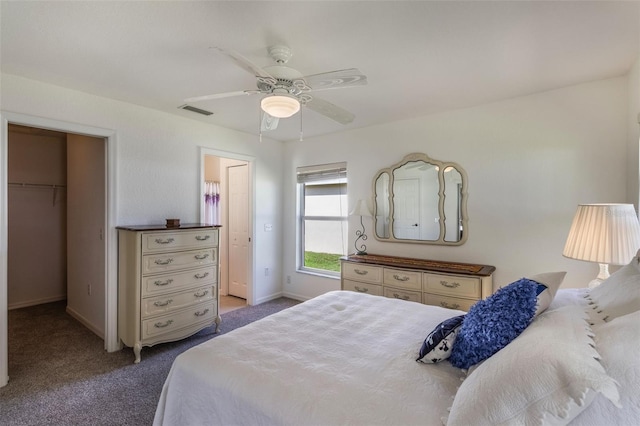 284 Lake Suzanne Dr, Lake Wales, FL 33859 - carpeted bedroom with baseboards, visible vents, a ceiling fan, a closet, and a walk in closet