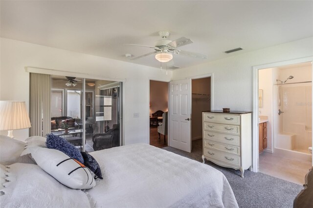 284 Lake Suzanne Dr, Lake Wales, FL 33859 - carpeted bedroom featuring a spacious closet, visible vents, a ceiling fan, access to exterior, and connected bathroom