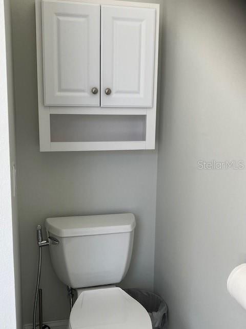 1681 Waterview Loop, Haines City, FL 33844 - bathroom with toilet and baseboards