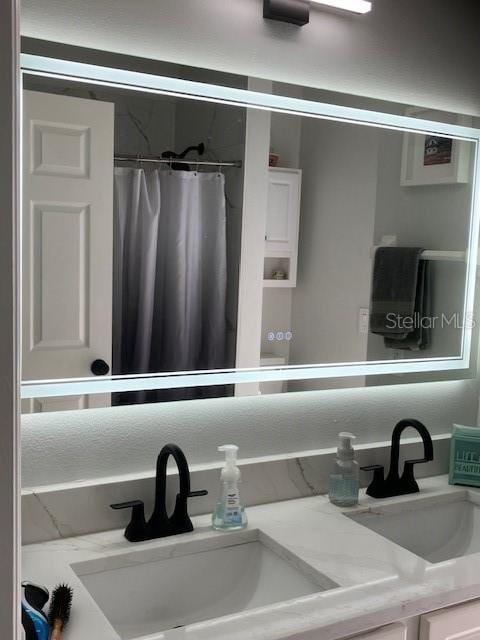1681 Waterview Loop, Haines City, FL 33844 - full bathroom featuring double vanity and a shower with curtain