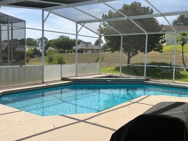 1681 Waterview Loop, Haines City, FL 33844 - outdoor pool with a lanai, a patio area, and a jacuzzi
