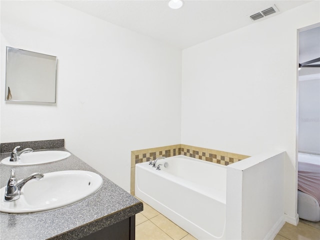 full bathroom with a sink, tile patterned floors, and visible vents