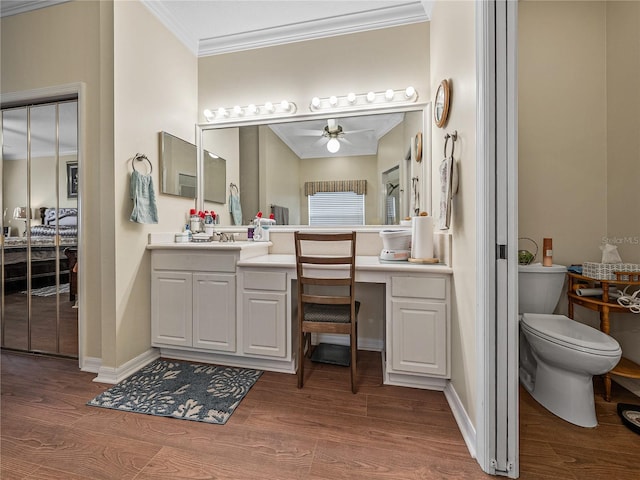4081 Dunmore Dr, Lake Wales, FL 33859 - full bathroom featuring ornamental molding, ceiling fan, wood finished floors, toilet, and vanity