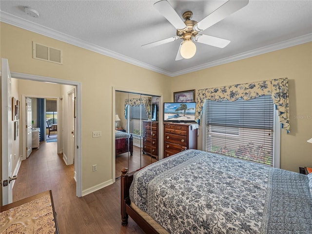 4081 Dunmore Dr, Lake Wales, FL 33859 - bedroom featuring ornamental molding, wood finished floors, a closet, baseboards, and a ceiling fan