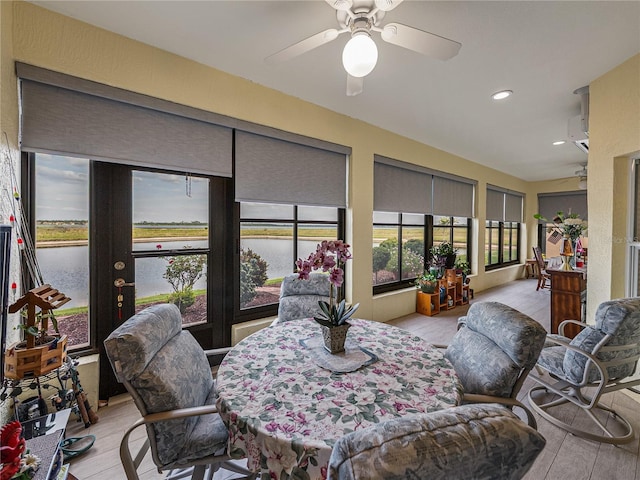 4081 Dunmore Dr, Lake Wales, FL 33859 - sunroom featuring a water view, wood finished floors, and recessed lighting