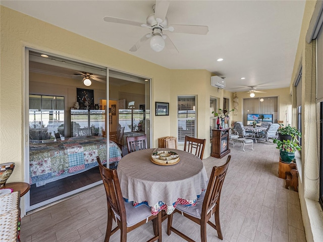 4081 Dunmore Dr, Lake Wales, FL 33859 - dining space featuring a ceiling fan, wood finished floors, an AC wall unit, and recessed lighting