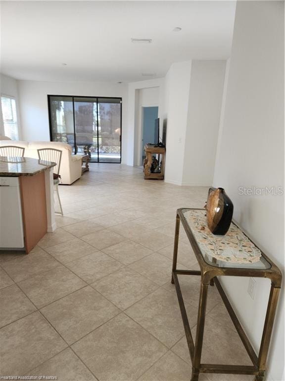 1375 Backspin Dr, Englewood, FL 34223 - hallway with light tile patterned floors