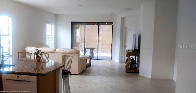 1375 Backspin Dr, Englewood, FL 34223 - living area with light tile patterned floors