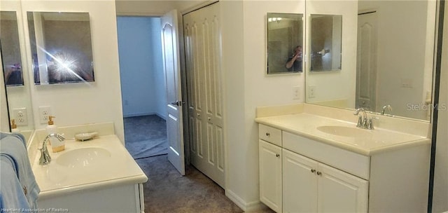 1375 Backspin Dr, Englewood, FL 34223 - bathroom featuring two vanities and a sink