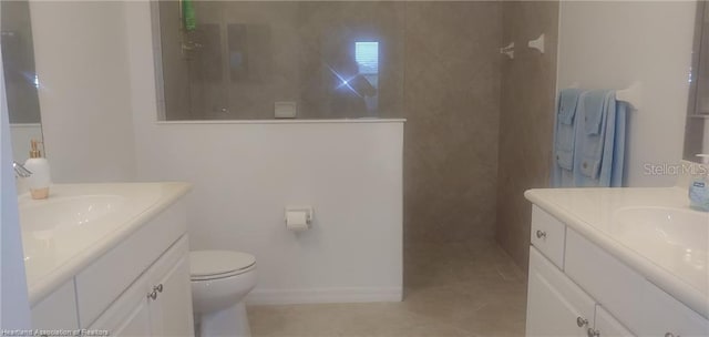 1375 Backspin Dr, Englewood, FL 34223 - full bathroom with tile patterned floors, two vanities, a walk in shower, and toilet