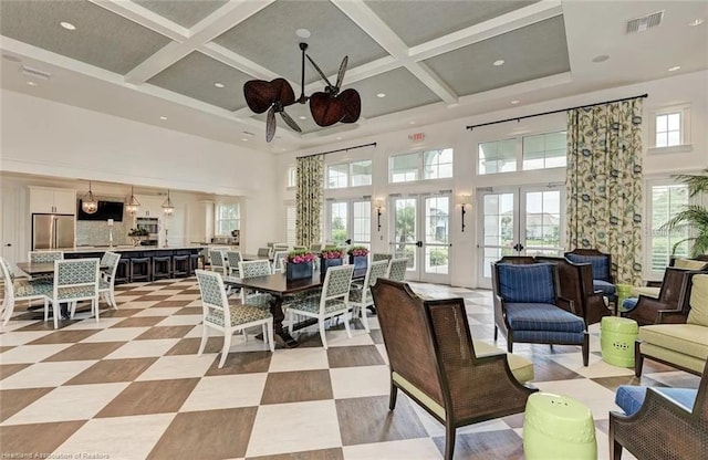 1375 Backspin Dr, Englewood, FL 34223 - dining area with coffered ceiling, a ceiling fan, a towering ceiling, and visible vents