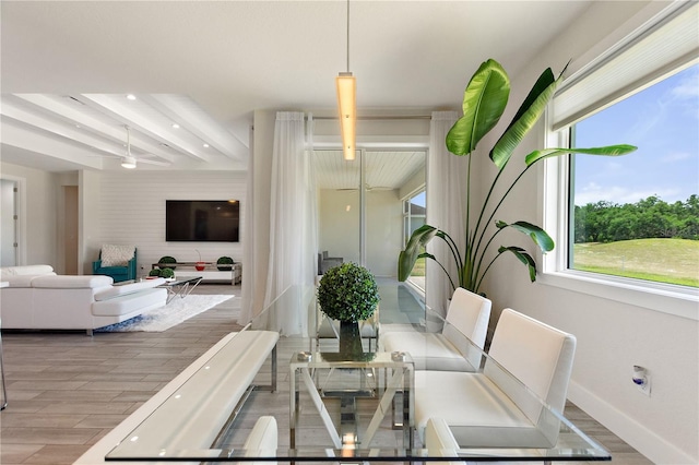dining space with recessed lighting, baseboards, wood finished floors, and beam ceiling