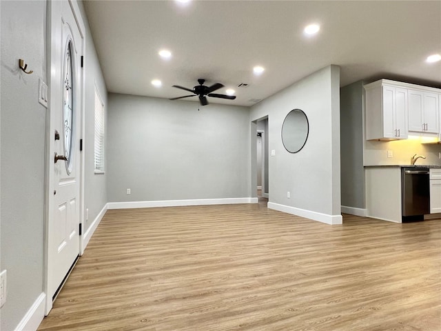 unfurnished living room with ceiling fan, recessed lighting, baseboards, and light wood-style floors