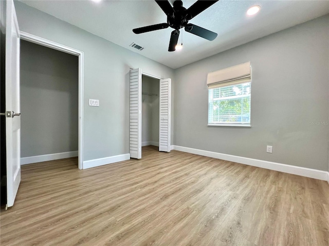 unfurnished bedroom with baseboards, visible vents, light wood-style flooring, and recessed lighting