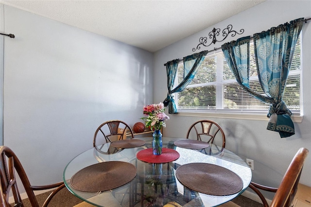 dining room with baseboards