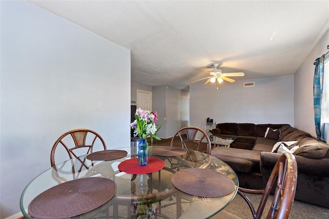 dining space featuring visible vents and ceiling fan