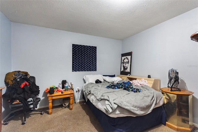 carpeted bedroom with a textured ceiling and baseboards