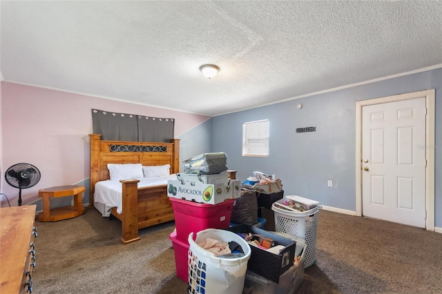 bedroom with ornamental molding, carpet, and a textured ceiling