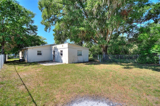 view of yard with a fenced backyard and a patio area