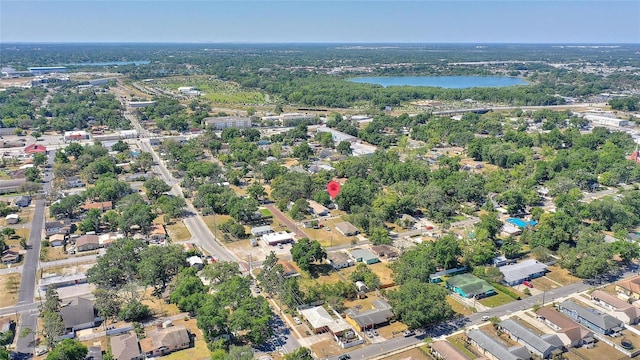 drone / aerial view with a water view and a residential view