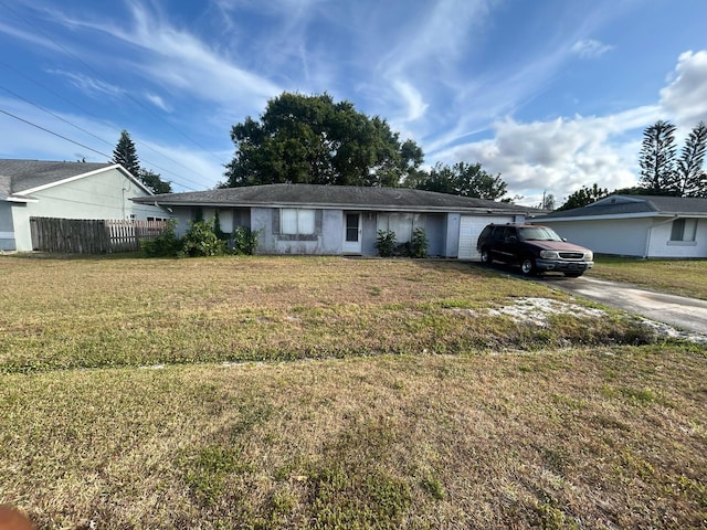 single story home featuring fence, a front lawn, concrete driveway, and an attached garage