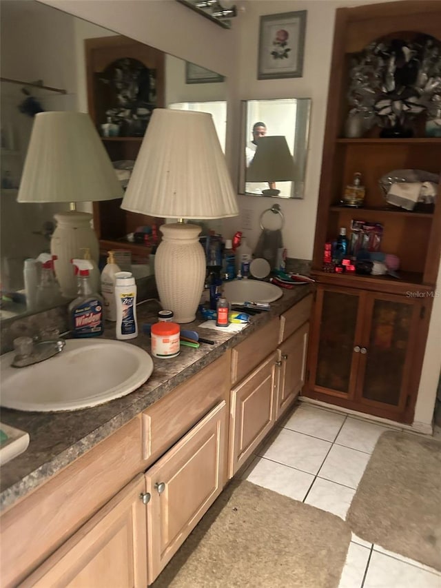 interior space featuring tile patterned flooring and a sink