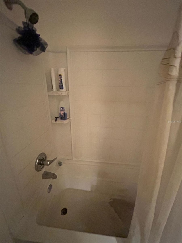 full bathroom with shower / bath combination with curtain