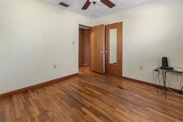 1371 Sheridan St SW, Winter Haven, FL 33880 - unfurnished room with visible vents, baseboards, ceiling fan, and hardwood / wood-style floors
