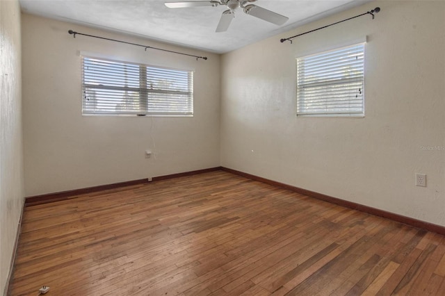 1371 Sheridan St SW, Winter Haven, FL 33880 - empty room featuring a ceiling fan, baseboards, a wealth of natural light, and hardwood / wood-style flooring