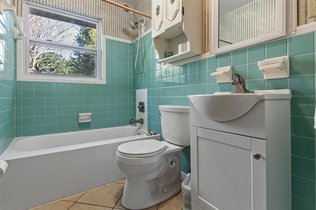 1371 Sheridan St SW, Winter Haven, FL 33880 - full bathroom with vanity, toilet, tile walls, tile patterned floors, and shower / bath combination