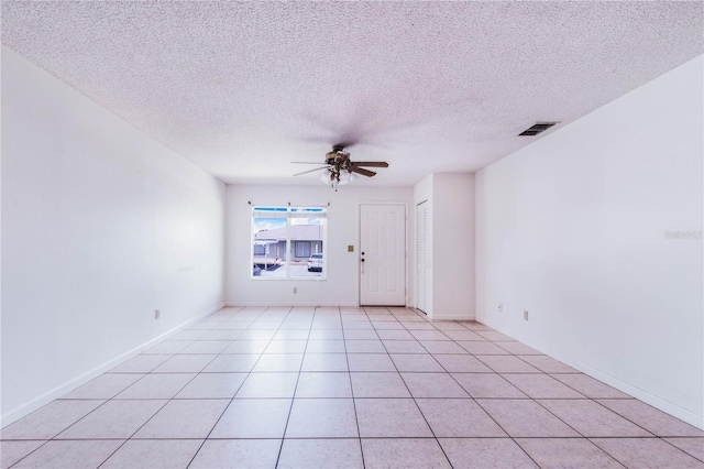 151 Winter Ridge Dr Unit 151, Winter Haven, FL 33881 - spare room featuring light tile patterned floors, ceiling fan, a textured ceiling, and visible vents