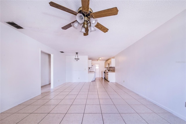 151 Winter Ridge Dr Unit 151, Winter Haven, FL 33881 - interior space featuring visible vents, a ceiling fan, a textured ceiling, and light tile patterned floors